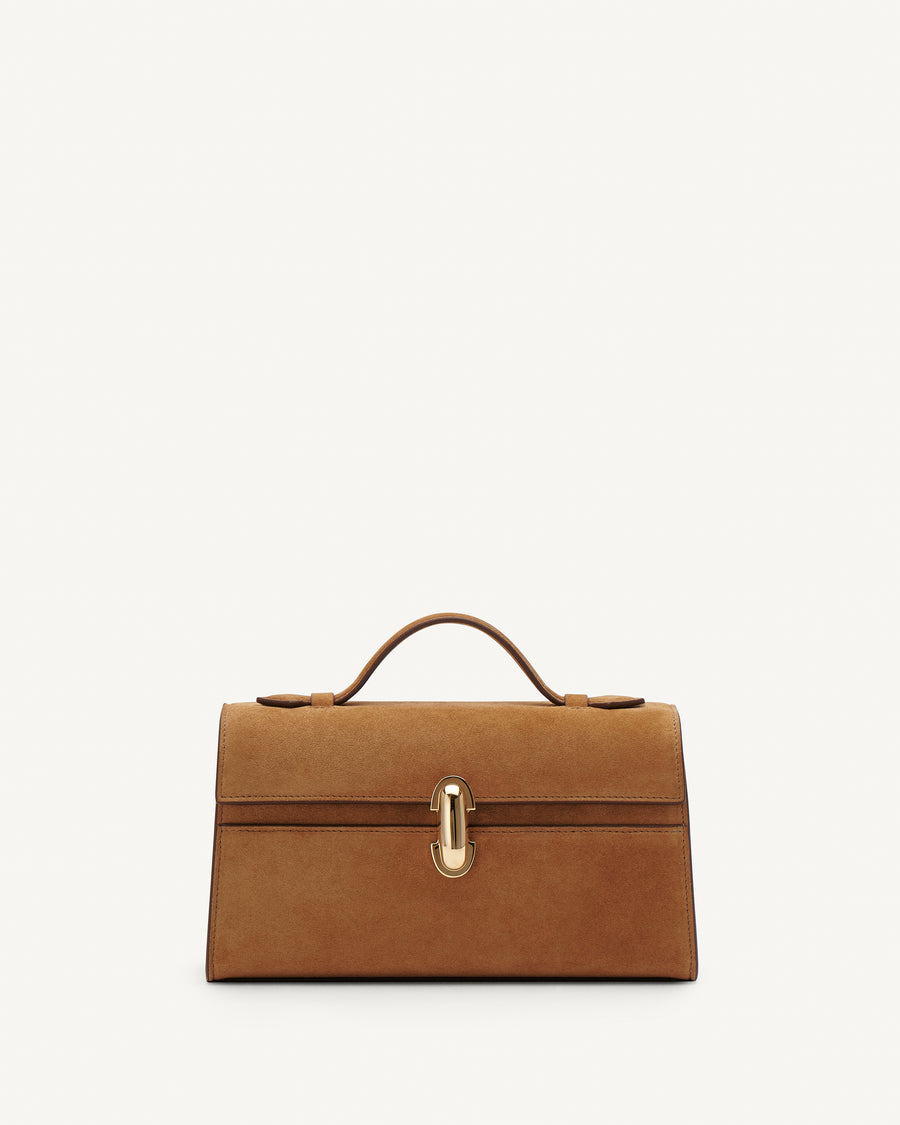 Front view of Saddle Suede leather handbag with a gold clasp on a white background