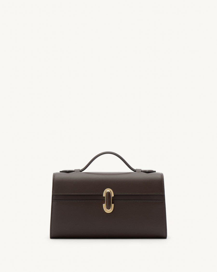front view of a coffee brown leather top handle bag with a coffee brown leather covered gold clasp on a white background