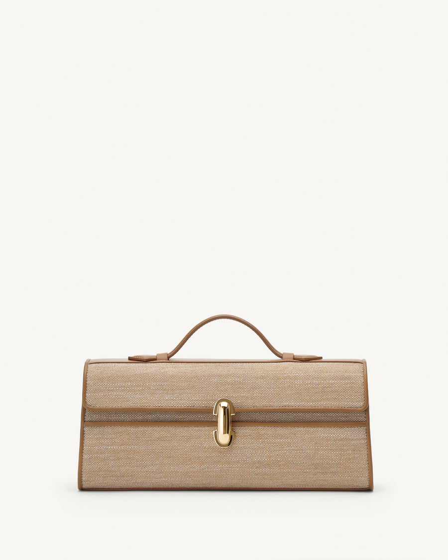 Front view of canvas handbag with a gold clasp on a white background