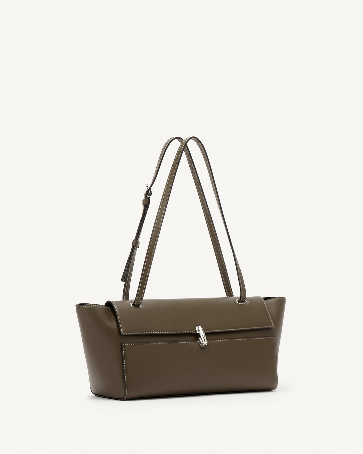 side view of a mink brown leather bag with a silver clasp on a white background