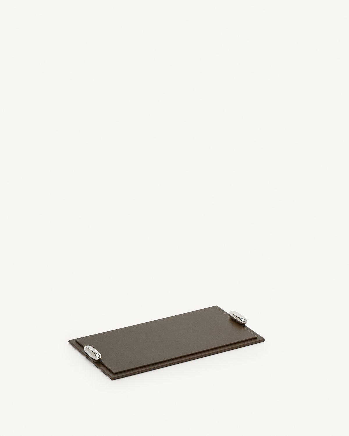 side view of a mink brown leather tray with silver hardware on a white background