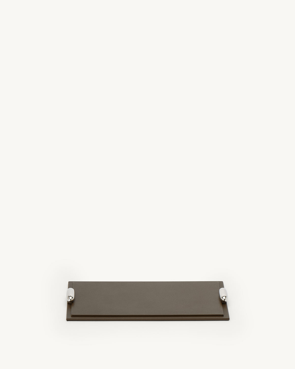 front view of a mink brown leather tray with silver hardware on a white background