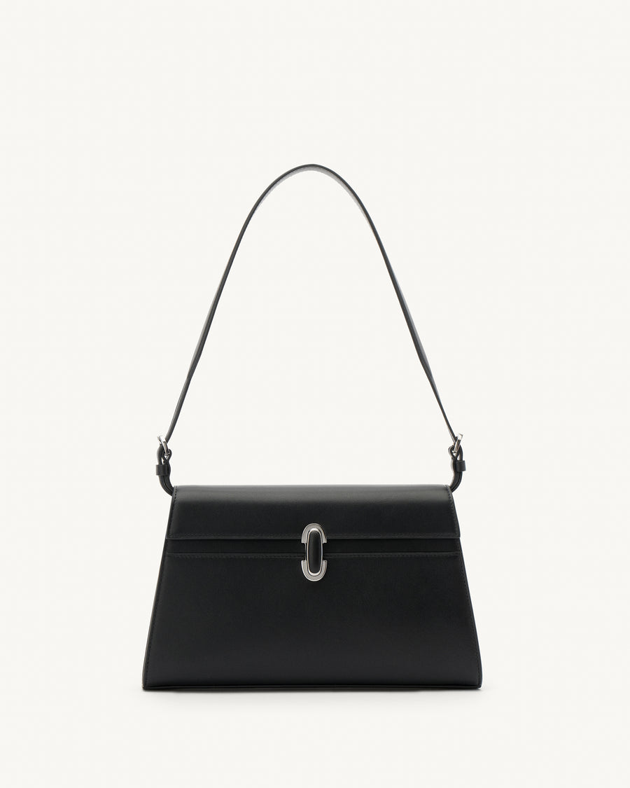 front view of a black leather shoulder bag with a black leather covered silver clasp on a white background