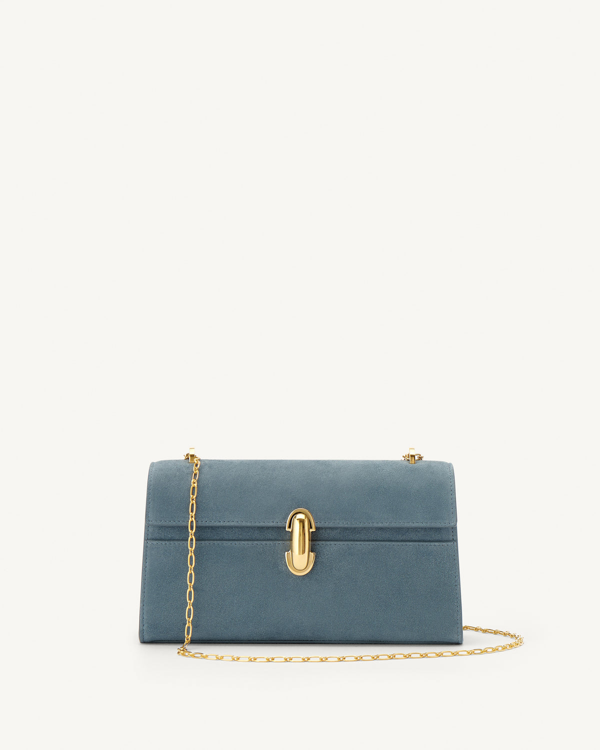 front view of a denim blue suede bag with a gold clasp and gold chain on a white background