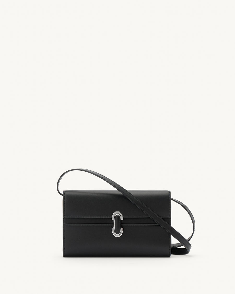 front view of a black leather handbag with a black leather covered silver clasp on a white background 