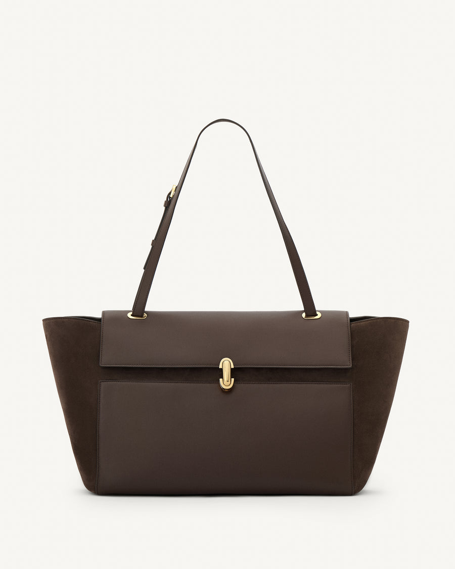 front view of a coffee brown smooth and suede leather tote bag with a gold clasp on a white background 