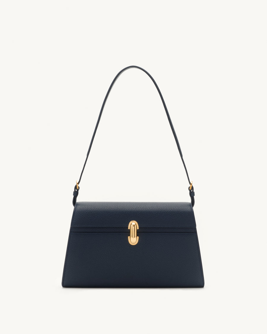 front view of navy blue bag with gold clasp on a white background