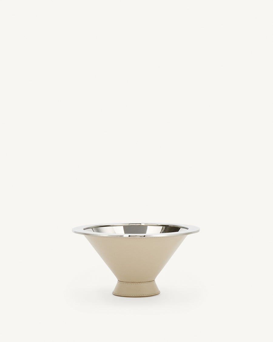 front view of a silver metal lined parchment beige leather dish on a white background