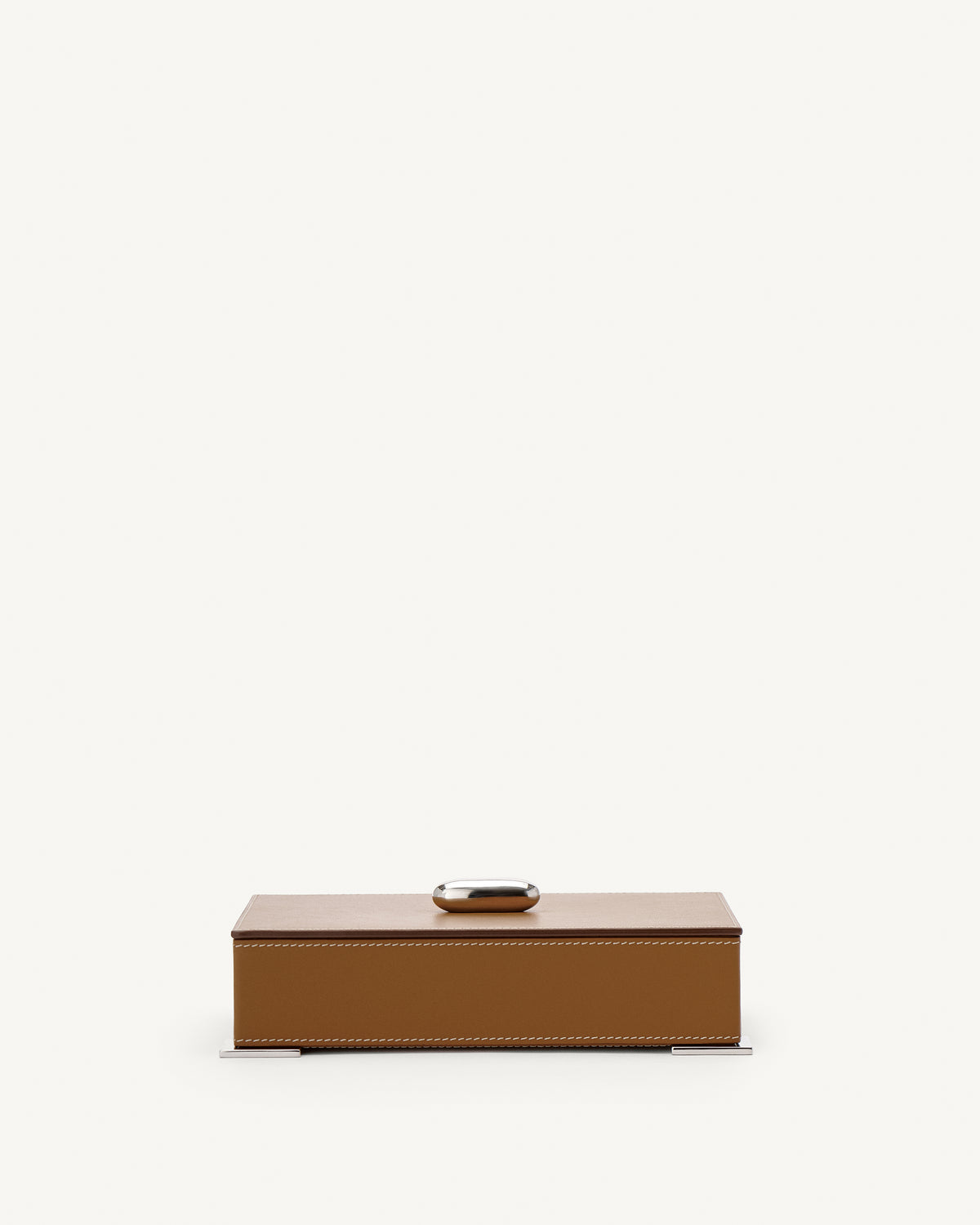 front view of a saddle brown leather box with silver hardware on a white background