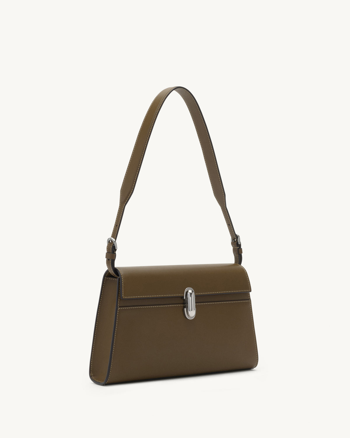 side view of mink brown bag with silver clasp on a white background