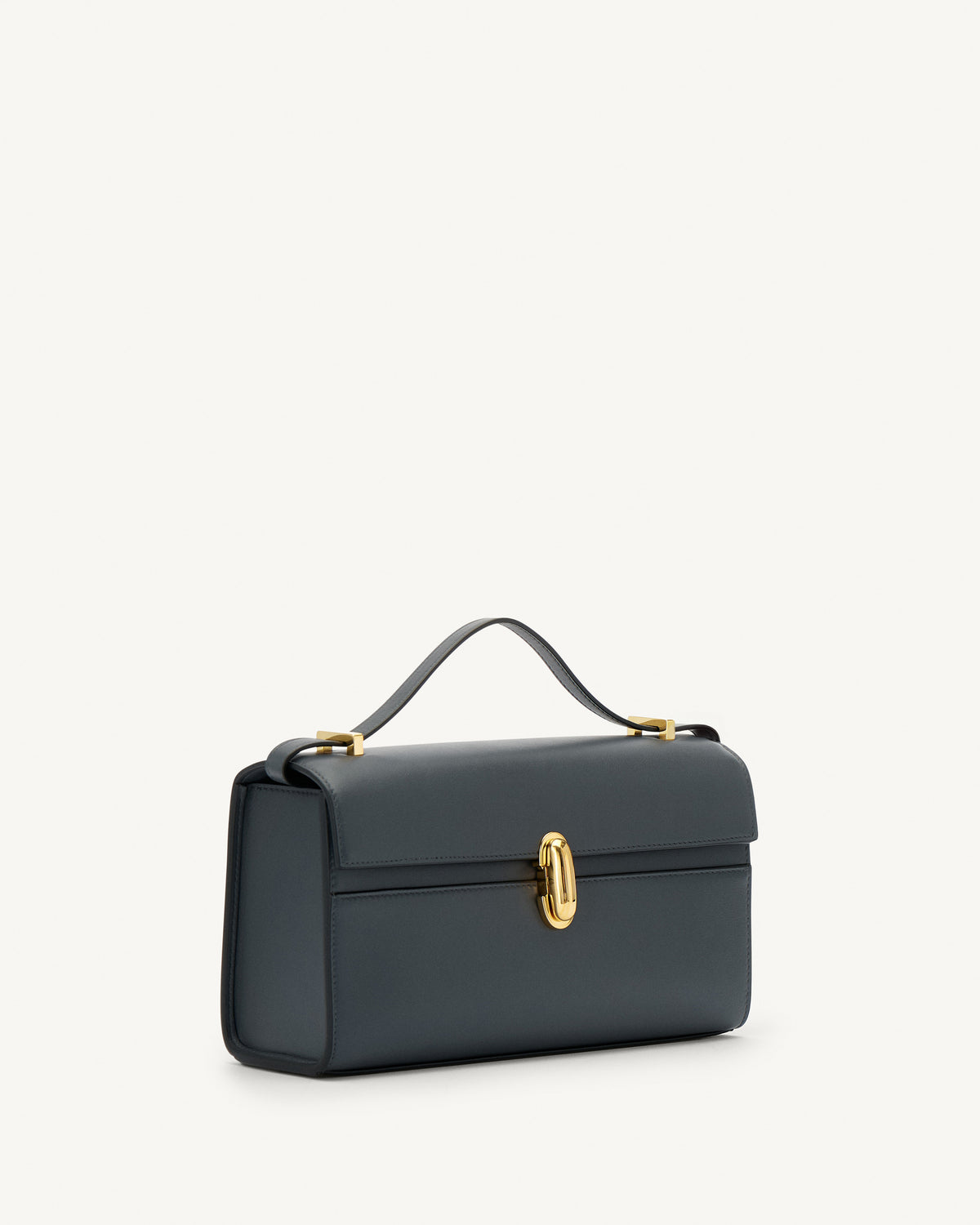 side view of a storm blue leather bag with a gold clasp on a white background