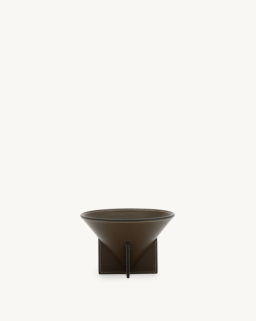 front view of a mink brown leather dish with white stitching on a white background
