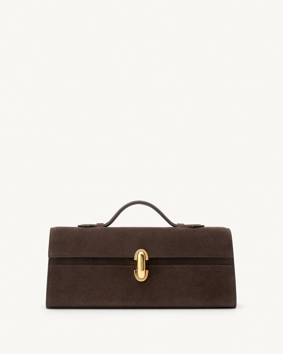 front view of a coffee brown suede top handle bag with a gold clasp on a white background 