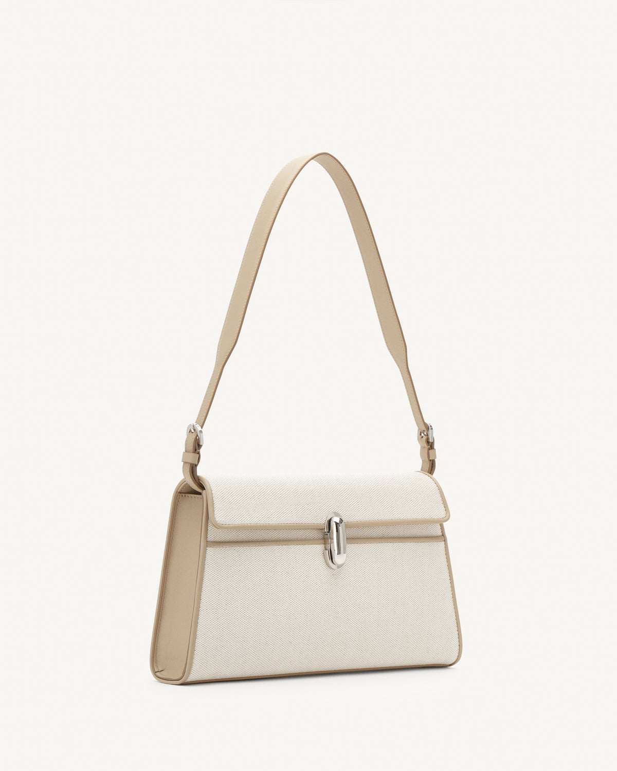 Side view of white canvas shoulder handbag with a silver chain strap on a white background