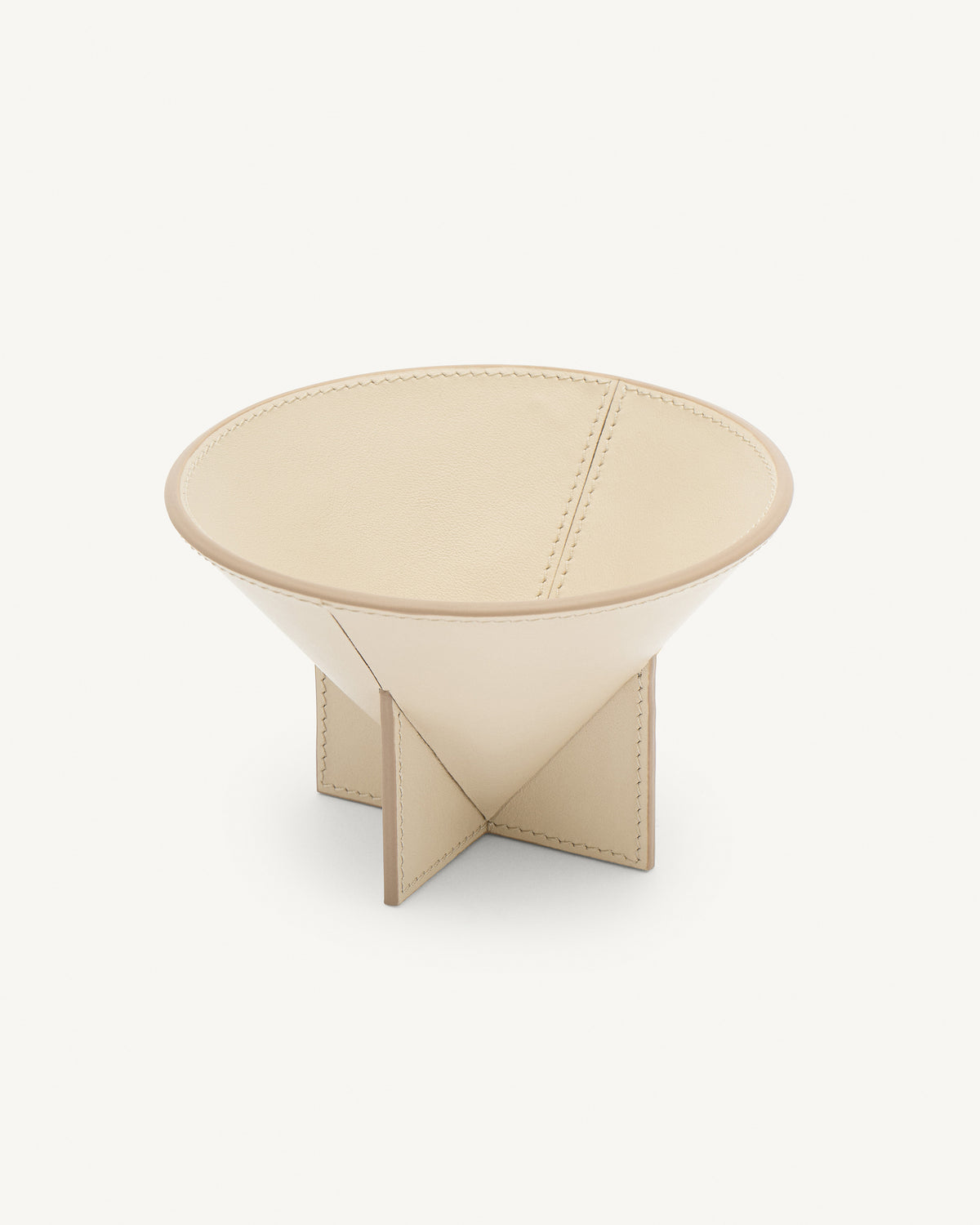interior view of a parchment beige leather dish on a white background