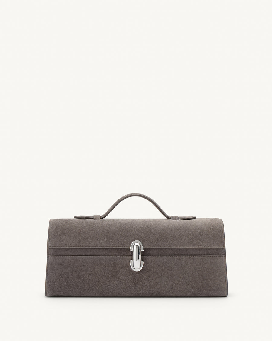 front view of a smoke grey suede handbag with a silver clasp on a white background 