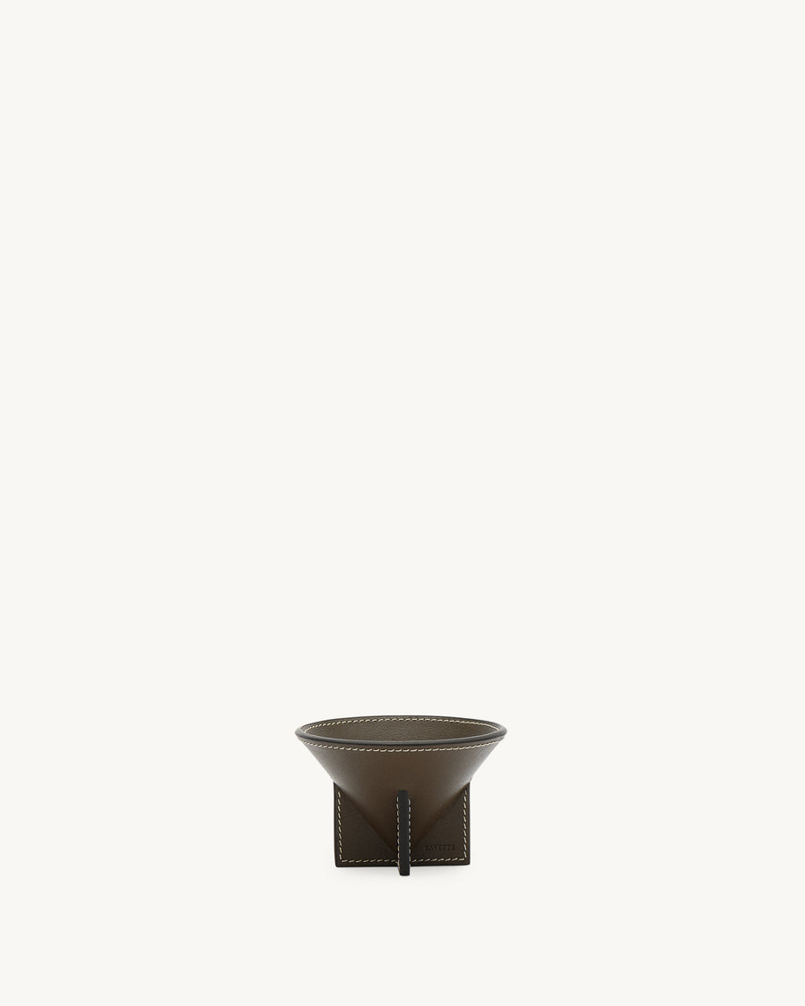 front view of a mink brown leather dish with white stitching on a white background