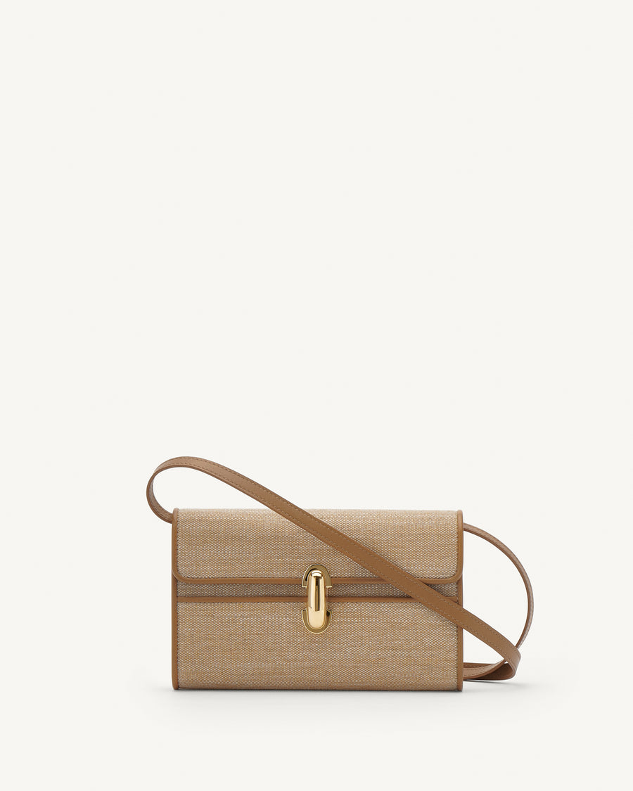 Front view of beige handbag with a brown strap and gold hardware on a white background