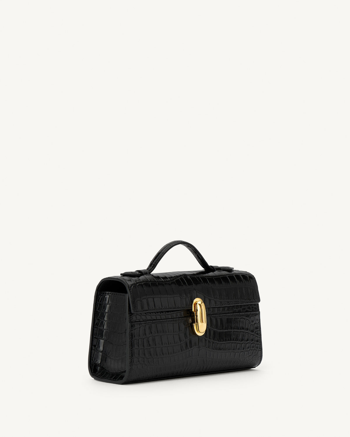 side view of a black crocodile bag with a gold clasp on a white background