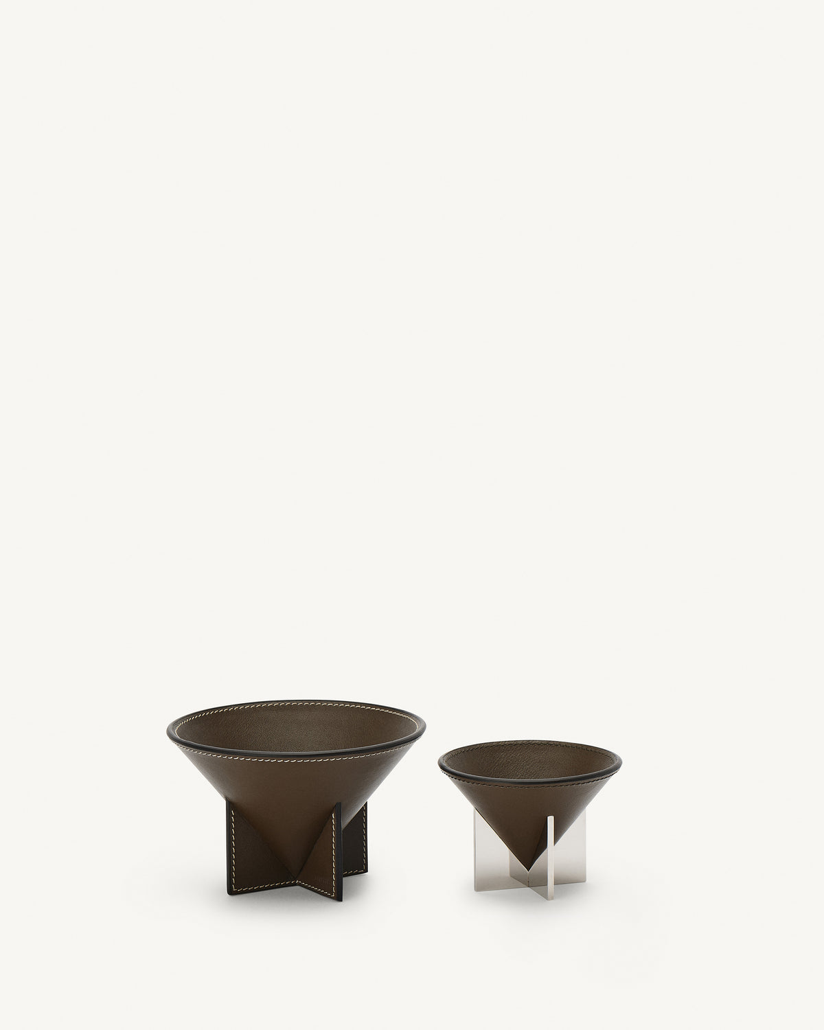 front view of two mink brown leather dishes on a white background