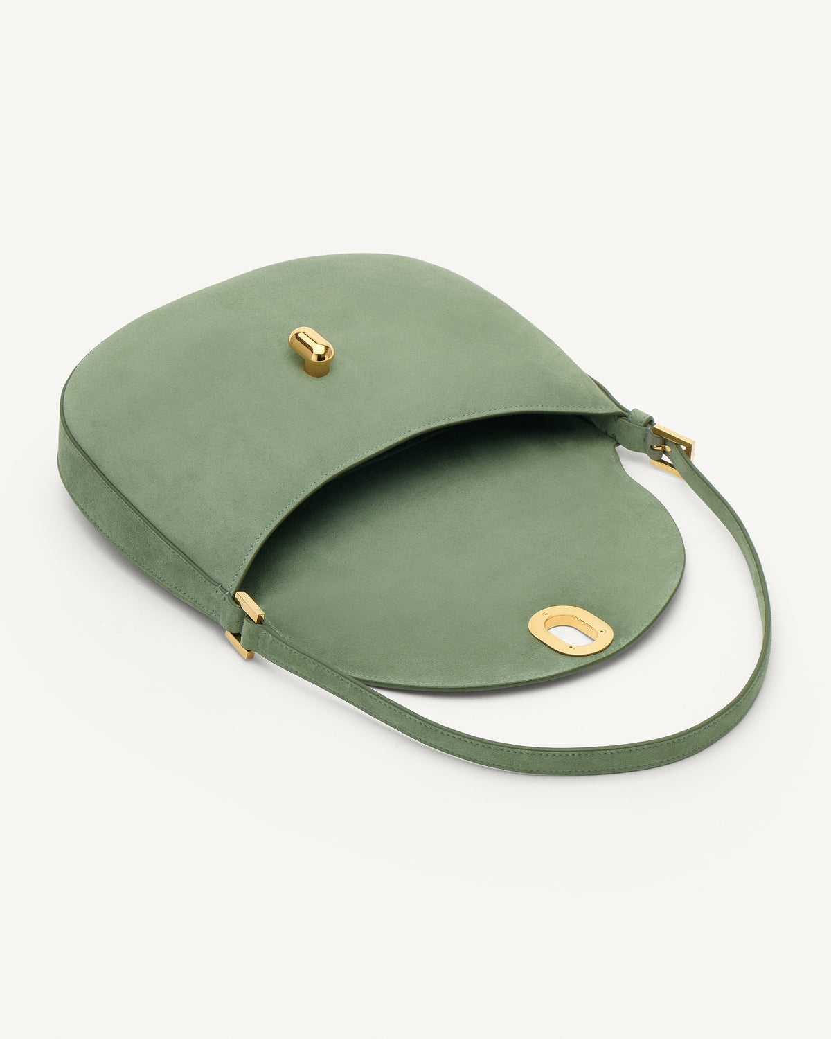 Inside view cactus suede handbag with a gold clasp on a white background