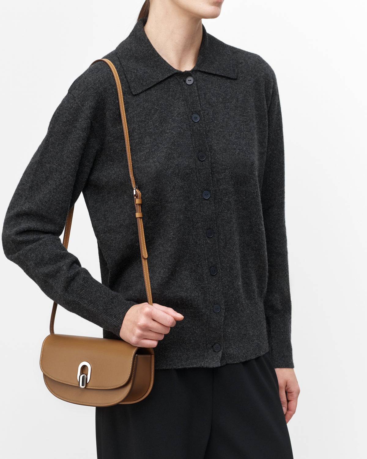 On model view of saddle leather crossbody with silver hardware