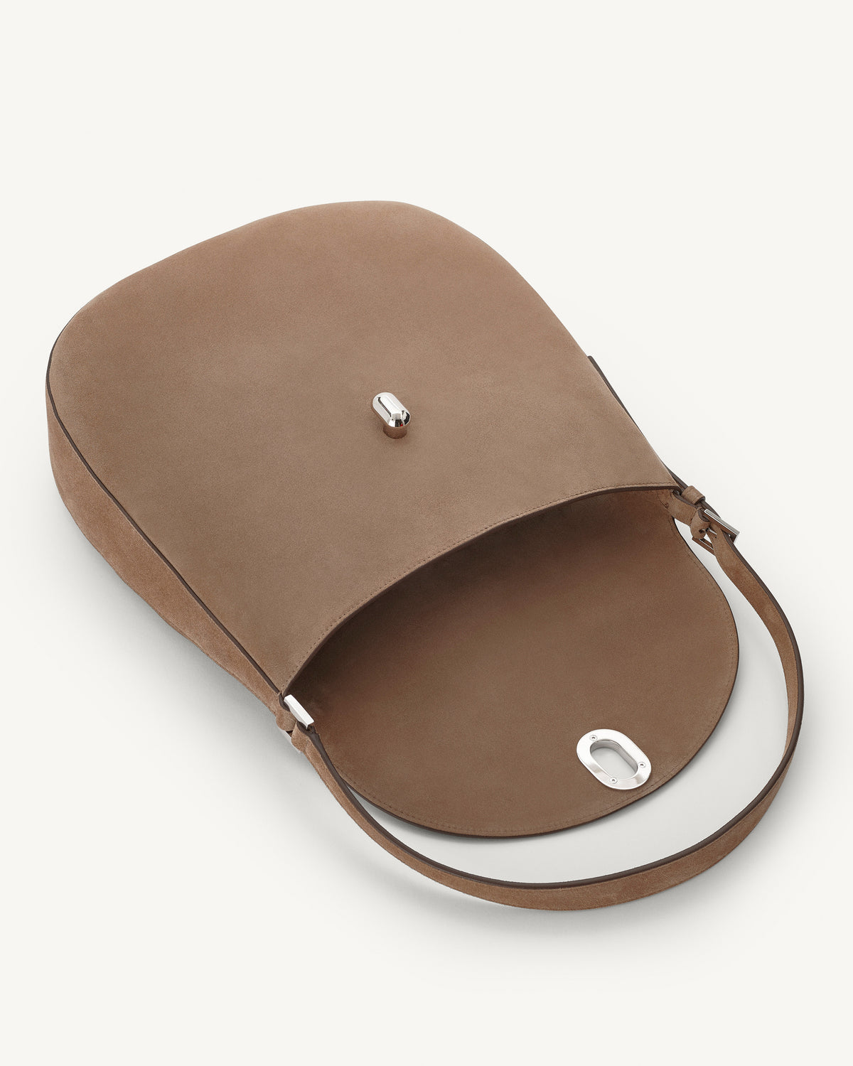 interior view of taupe brown suede bag with silver hardware on a white background