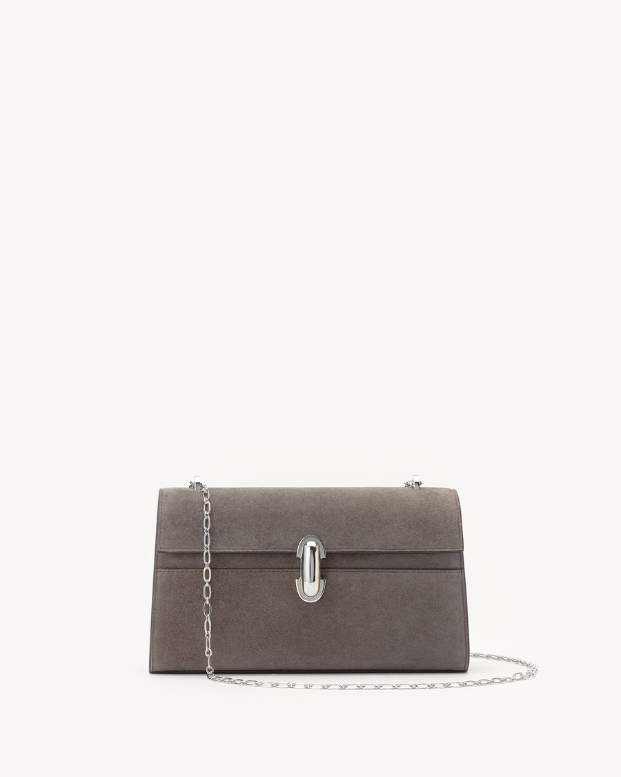 front view of a smoke grey suede bag with a silver chain and silver clasp on a white background 