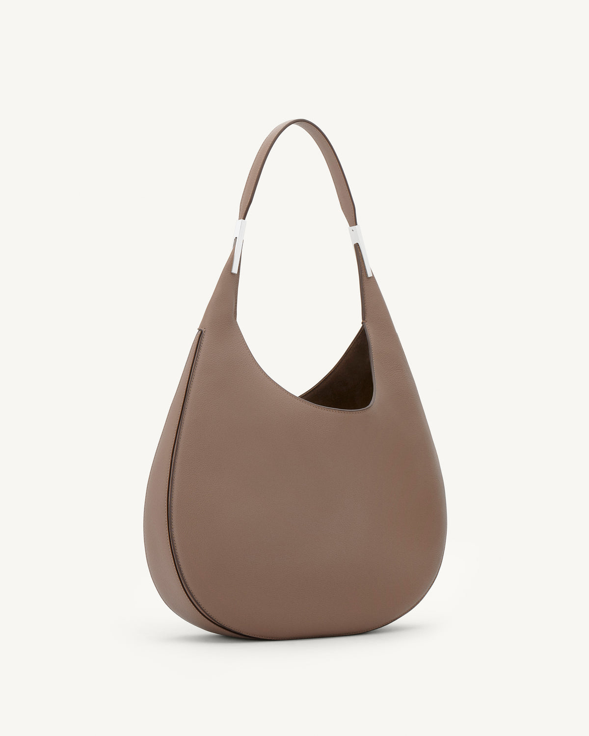 side view of a taupe brown bag with silver hardware on a white background
