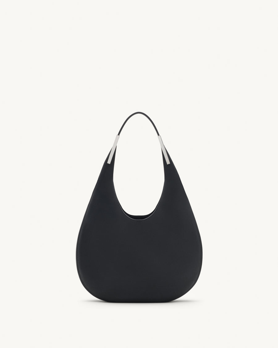 front view of black bag with silver hardware on a white background