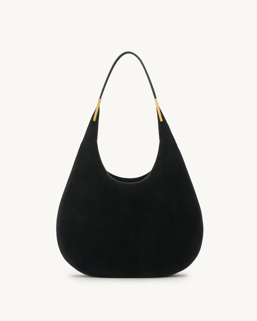 front view of black suede bag with gold hardware on a white background