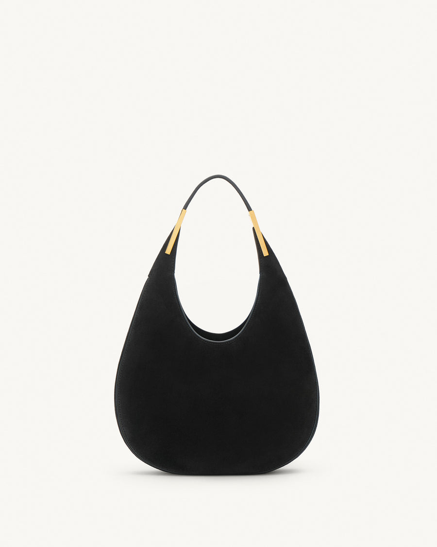 front view of a black suede bag with gold hardware on a white background