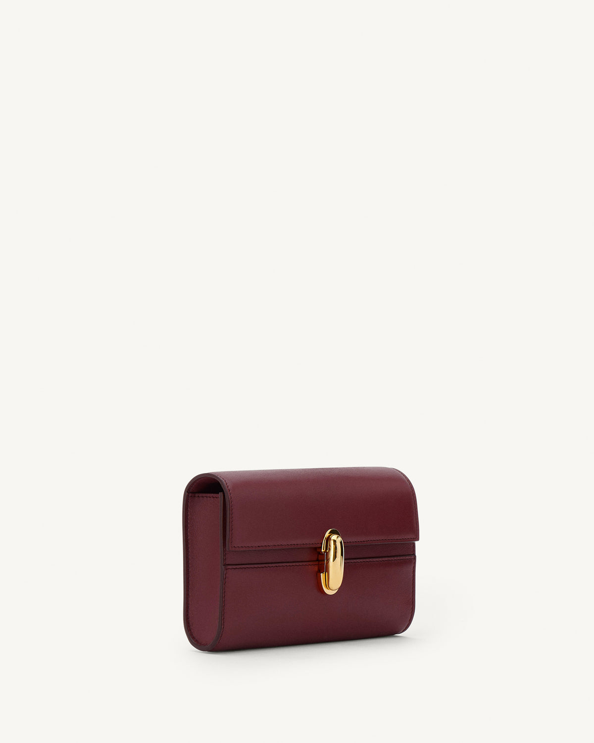 side view of a wine red bag with gold clasp on a white background