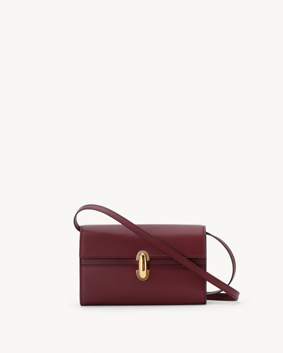 front view of a wine red bag with gold clasp on a white background