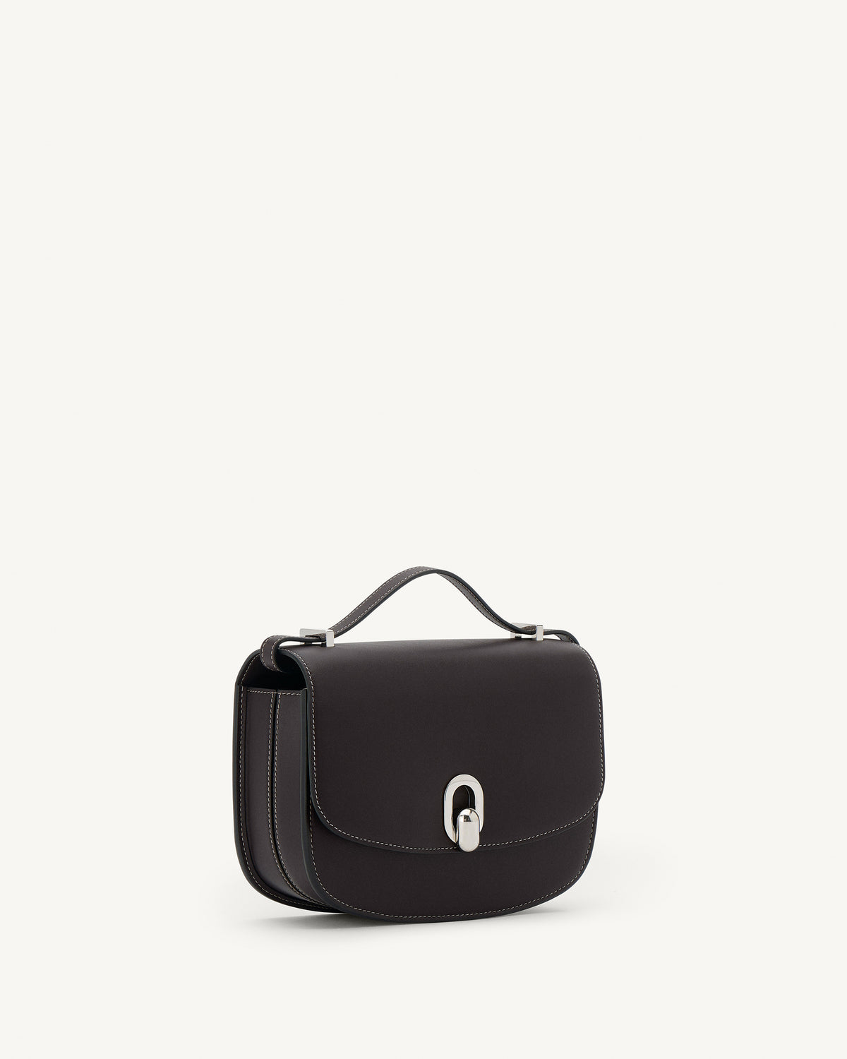 side view of a currant brown bag with silver clasp on a white background