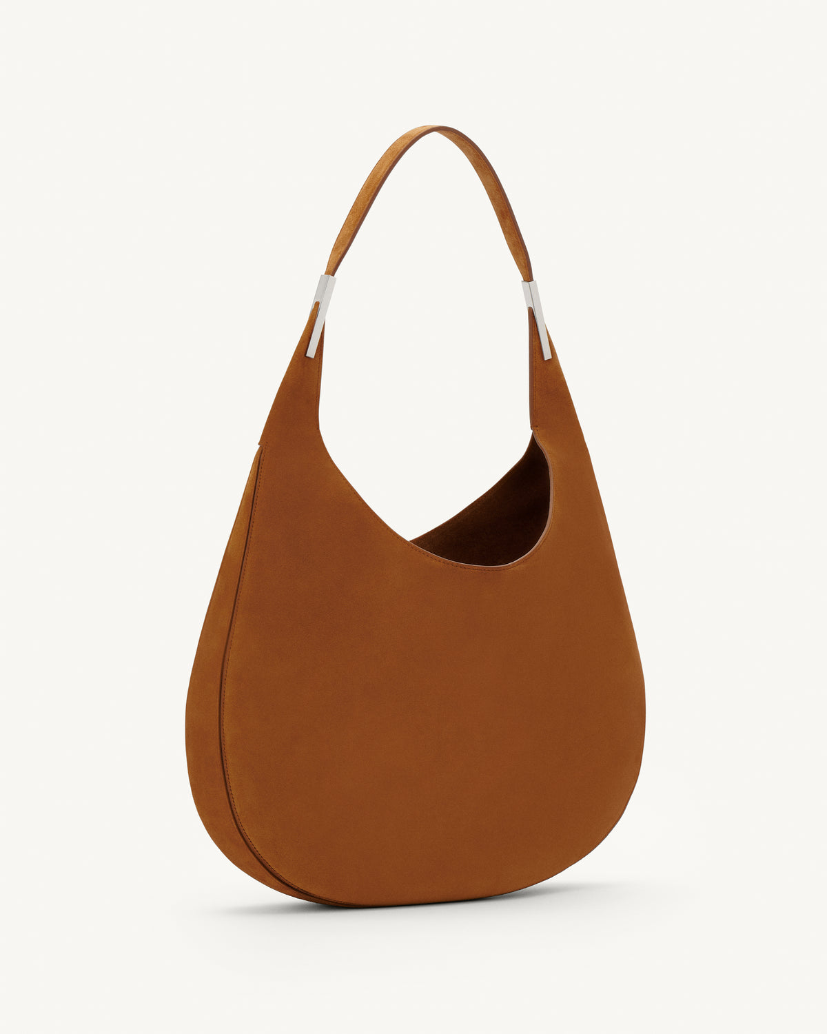side view of a cognac brown suede shoulder bag with silver hardware 