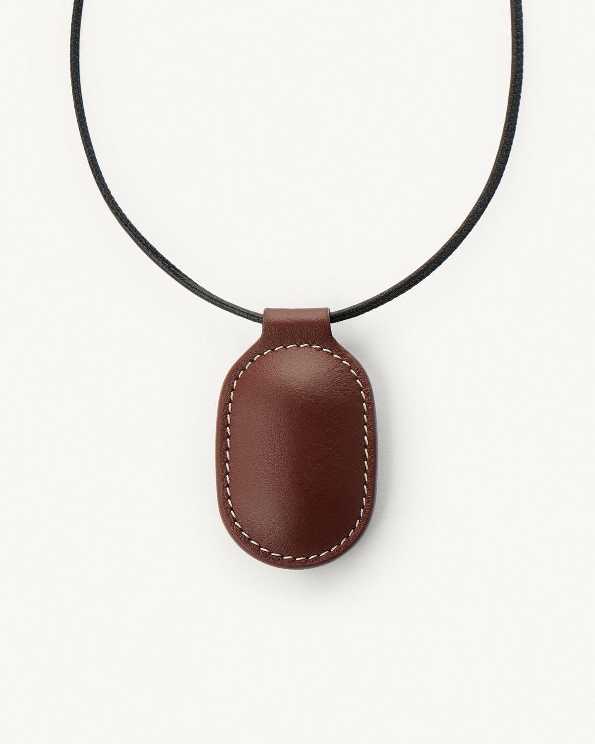 front view of espresso brown leather pendant on a white background