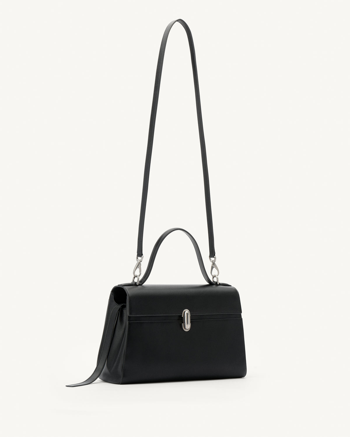 side view of a black leather handbag with a silver clasp on a white background