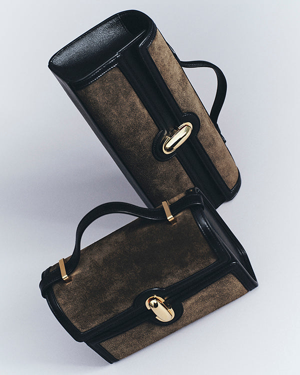 editorial image of two mink brown bags on an off white background
