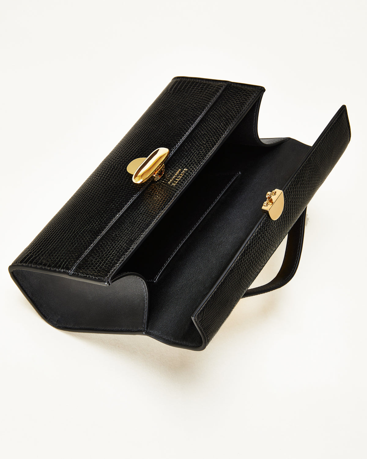inside view of the Symmetry Pochette handbag in Black lizard